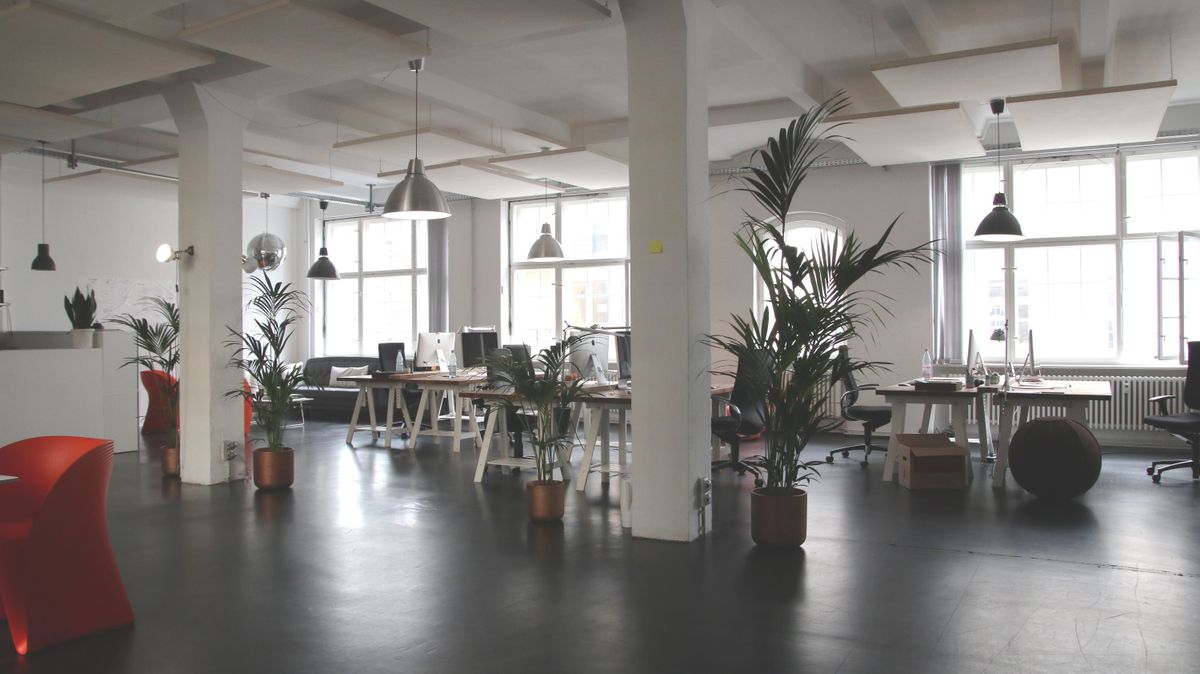 Creative loft-style office interior with open workspace