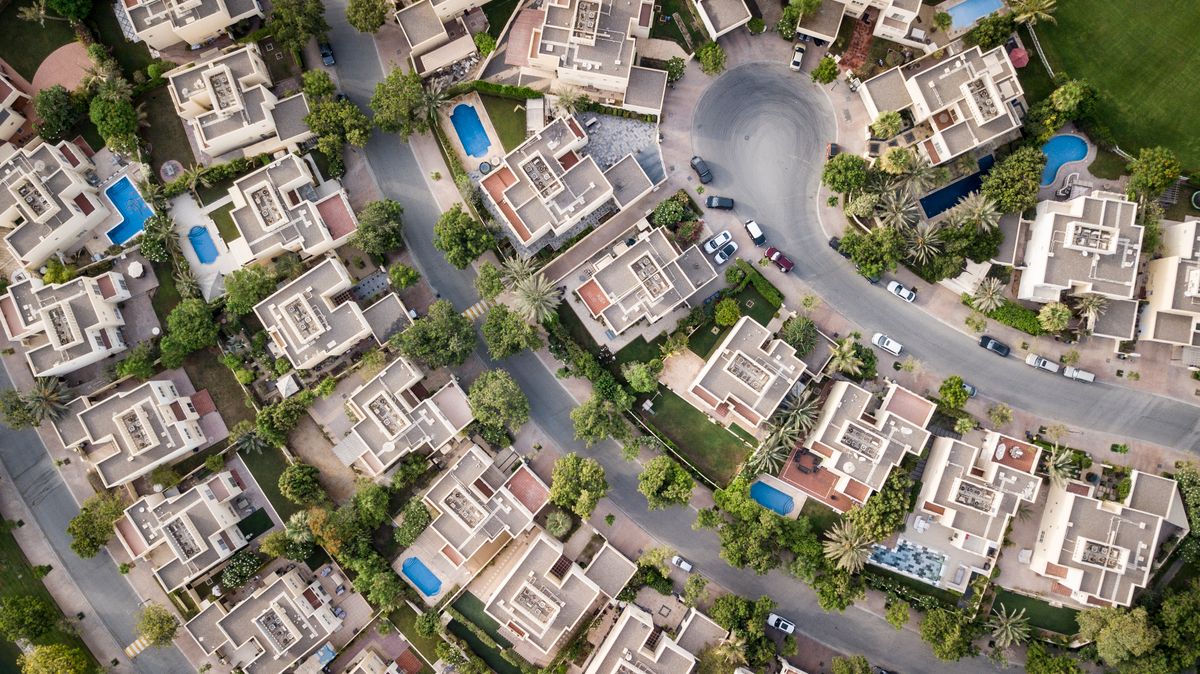 Aerial view of a planned residential community and land parcels